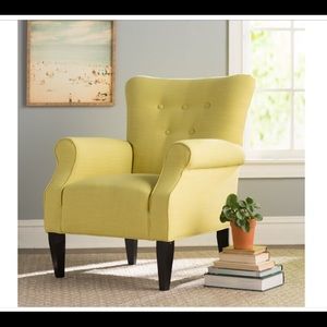 Yellow button back armchair